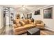 Living room with comfortable seating, grey walls, wood-look flooring, a staircase, and decorative accents at 919 Havre Ave, Henderson, NV 89015