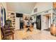 Cozy living room featuring a stone fireplace, custom built-ins, and comfortable seating arrangement at 919 Havre Ave, Henderson, NV 89015
