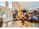 Spacious living room with a stone fireplace and eclectic decor at 919 Havre Ave, Henderson, NV 89015