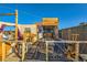 Outdoor patio area with wooden furniture, bar, and string lights at 919 Havre Ave, Henderson, NV 89015