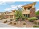 Two-story home with attached garage and mature landscaping at 101 San Martino Pl, Henderson, NV 89011