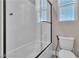 Clean bathroom with a shower/tub combo and white tile at 10301 Fairview Ridge Ct, Las Vegas, NV 89166