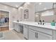 Modern bathroom with double vanity, quartz countertop, and walk-in closet at 10301 Fairview Ridge Ct, Las Vegas, NV 89166