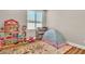 Playful bedroom with a play tent and toy storage at 10301 Fairview Ridge Ct, Las Vegas, NV 89166