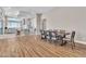 Bright dining room with wood flooring and seating for eight at 10301 Fairview Ridge Ct, Las Vegas, NV 89166