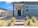 Front entrance with a covered walkway and modern gate at 10301 Fairview Ridge Ct, Las Vegas, NV 89166