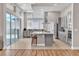 Modern kitchen with island, stainless steel appliances, and grey cabinets at 10301 Fairview Ridge Ct, Las Vegas, NV 89166