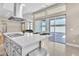 Modern kitchen with island, stainless steel appliances, and access to backyard at 10301 Fairview Ridge Ct, Las Vegas, NV 89166