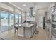 Open kitchen with large island and sliding glass doors at 10301 Fairview Ridge Ct, Las Vegas, NV 89166