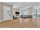 Open living area with hardwood floors and modern fireplace at 10301 Fairview Ridge Ct, Las Vegas, NV 89166