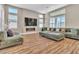 Bright and airy living room with a large sectional sofa and modern fireplace at 10301 Fairview Ridge Ct, Las Vegas, NV 89166