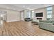Spacious living room with hardwood floors and a modern fireplace at 10301 Fairview Ridge Ct, Las Vegas, NV 89166