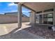 Covered patio with brick pavers and access to the backyard at 10301 Fairview Ridge Ct, Las Vegas, NV 89166