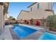 Backyard featuring a rectangular pool, spa, and landscaping that creates a serene and private outdoor space at 10729 Beecher Park Ave, Las Vegas, NV 89166