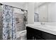 Modern bathroom featuring a walk-in shower with a tile surround and a sleek vanity at 10729 Beecher Park Ave, Las Vegas, NV 89166