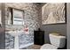 Chic half bathroom featuring modern vanity with stylish tile backsplash and contemporary finishes at 10729 Beecher Park Ave, Las Vegas, NV 89166