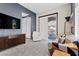 Comfortable bedroom featuring a sliding door to the patio and a wall-mounted TV at 10729 Beecher Park Ave, Las Vegas, NV 89166