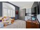 Stylish bedroom with a Murphy bed, a large window with plantation shutters, and ample cabinet space at 10729 Beecher Park Ave, Las Vegas, NV 89166