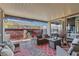 Cozy covered patio with comfortable seating, stylish decor, and seamless access to the indoor living space at 10729 Beecher Park Ave, Las Vegas, NV 89166