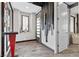 Stylish foyer featuring modern decor, a contemporary front door, and ample natural light at 10729 Beecher Park Ave, Las Vegas, NV 89166