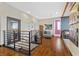 Hallway with hardwood floors, modern lighting and metal railings at 10729 Beecher Park Ave, Las Vegas, NV 89166