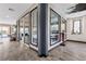 Hallway with large windows offering plenty of natural light and a view to the backyard at 10729 Beecher Park Ave, Las Vegas, NV 89166