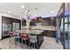 Gourmet kitchen featuring an island with seating and stainless steel appliances at 10729 Beecher Park Ave, Las Vegas, NV 89166