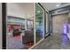Stylish covered patio with an array of comfortable seating options and multiple sliding doors for an indoor-outdoor flow at 10729 Beecher Park Ave, Las Vegas, NV 89166