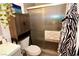 Bathroom with shower, toilet, and cabinet at 1303 Darlene Way # 102B, Boulder City, NV 89005
