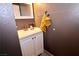 Updated bathroom with white vanity and tile floor at 1303 Darlene Way # 102B, Boulder City, NV 89005