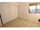 Well-lit bedroom featuring tile floors and a window with a view at 1303 Darlene Way # 102B, Boulder City, NV 89005