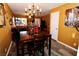 Bright dining room with wood table and chandelier at 1303 Darlene Way # 102B, Boulder City, NV 89005