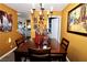Bright dining room with a wooden table and chairs, ready for dinner parties at 1303 Darlene Way # 102B, Boulder City, NV 89005