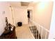Clean hallway with tile floors and staircase access at 1303 Darlene Way # 102B, Boulder City, NV 89005