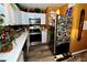 Bright kitchen with white cabinets and stainless steel appliances at 1303 Darlene Way # 102B, Boulder City, NV 89005