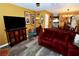 Comfortable living room with hardwood-style floors, plush velvet couch and a mounted flat-screen TV at 1303 Darlene Way # 102B, Boulder City, NV 89005