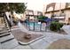 Clean, refreshing community pool with surrounding landscaping at 1303 Darlene Way # 102B, Boulder City, NV 89005
