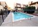 Inviting community pool with surrounding patio and fence at 1303 Darlene Way # 102B, Boulder City, NV 89005