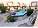 Community pool with surrounding landscaping and stairs at 1303 Darlene Way # 102B, Boulder City, NV 89005