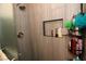 Shower with tiled walls and built-in shelves at 1303 Darlene Way # 102B, Boulder City, NV 89005