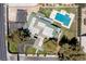 Aerial view of a large, gated property featuring a pool, backyard lounge area, mature trees, and circular drive at 1630 Westwood Dr, Las Vegas, NV 89102
