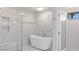 Bathroom with a soaking tub, a walk-in shower, and bright lighting at 1630 Westwood Dr, Las Vegas, NV 89102