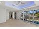 Bright bedroom with pool views, large windows, neutral carpet, and recessed lighting at 1630 Westwood Dr, Las Vegas, NV 89102