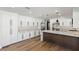 Modern kitchen with white cabinets, stainless steel appliances, and wood floors at 1630 Westwood Dr, Las Vegas, NV 89102