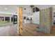 Open-concept living room showcasing views of the kitchen and backyard with pool at 1630 Westwood Dr, Las Vegas, NV 89102