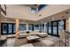 Open living room with modern furniture, a wet bar, and seamless access to the outdoor pool area at 1630 Westwood Dr, Las Vegas, NV 89102