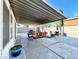 Covered back patio is furnished with chairs and benches, and has an open-air feel at 2600 Congress Ave, Las Vegas, NV 89121
