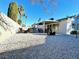 Back yard with covered patio, grill, and white gravel at 2600 Congress Ave, Las Vegas, NV 89121