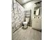 Updated bathroom showcasing modern fixtures, a marble shower curtain, and sleek shelving for added storage space at 2600 Congress Ave, Las Vegas, NV 89121