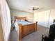 This bedroom features a wooden bed frame, carpet, and large closets at 2600 Congress Ave, Las Vegas, NV 89121